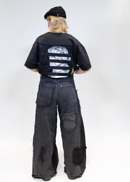 female model wearing eli basic tee with jeans from the back