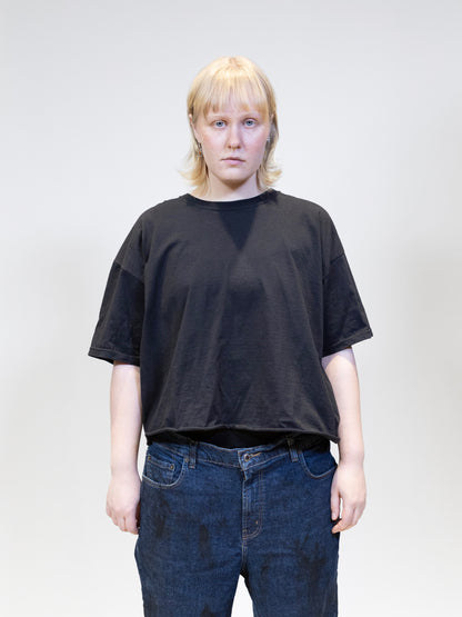 female model wearing cropped basic tee from the front