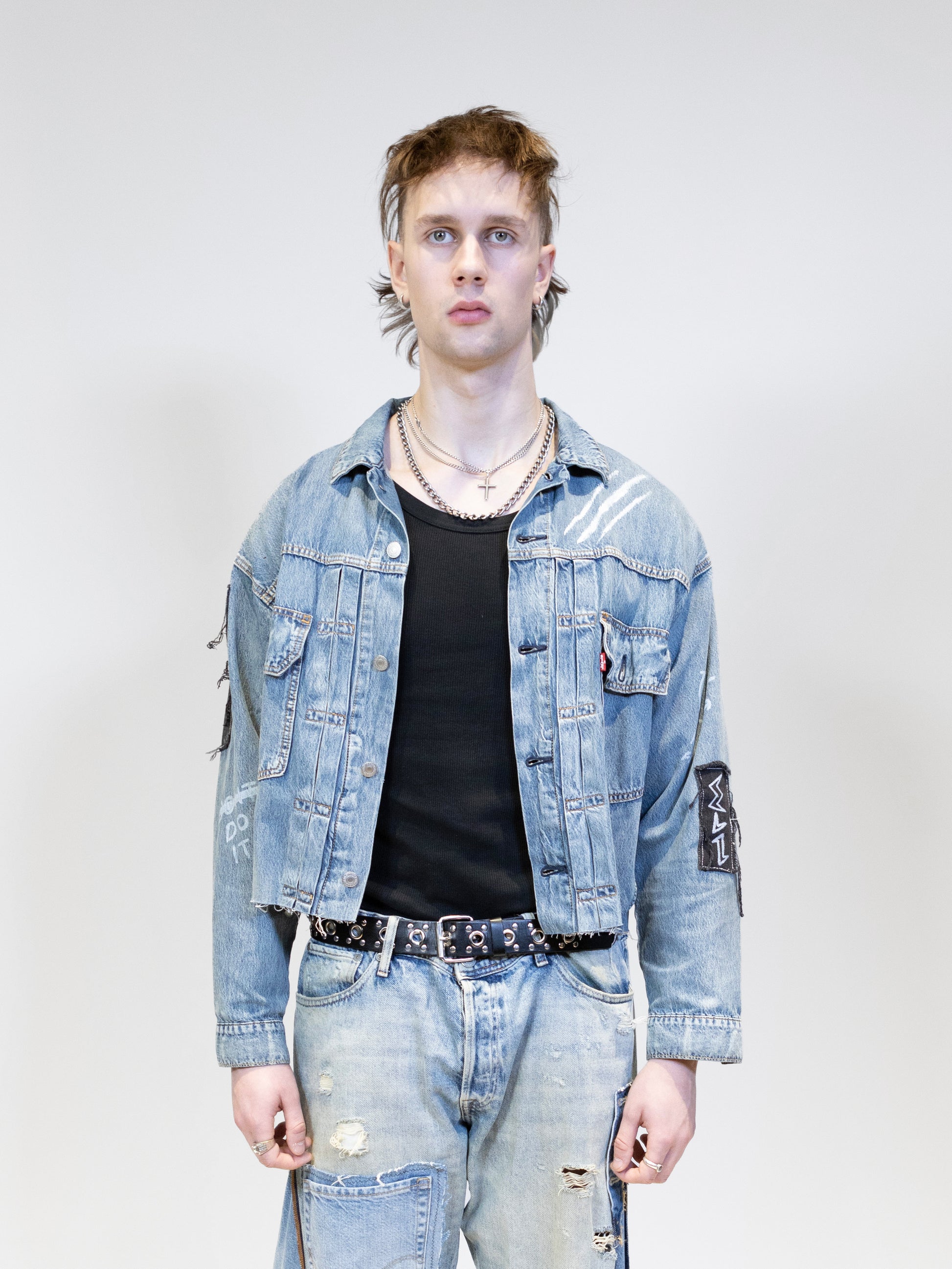 male model wearing eli originals denim jacket from the front