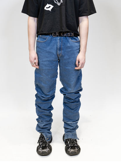 exaggeratedly long blue jeans on malemodel front