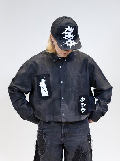 model wearing tar shirt with patches, front picture