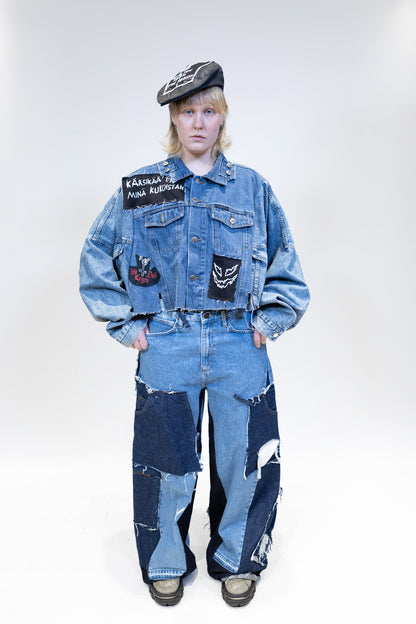 female model wearing full denim outfit with patches denim jeans from the front full picture